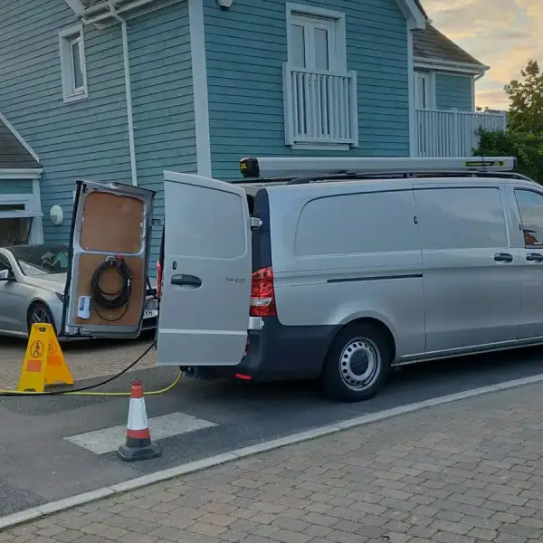Van with jetting kit parked outside a house to clear a blocked internal stack