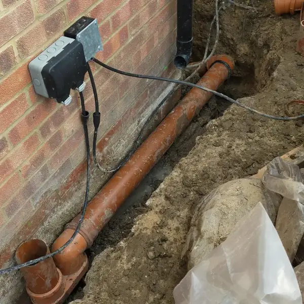 New underground drain pipe connected for an ACO channel installation