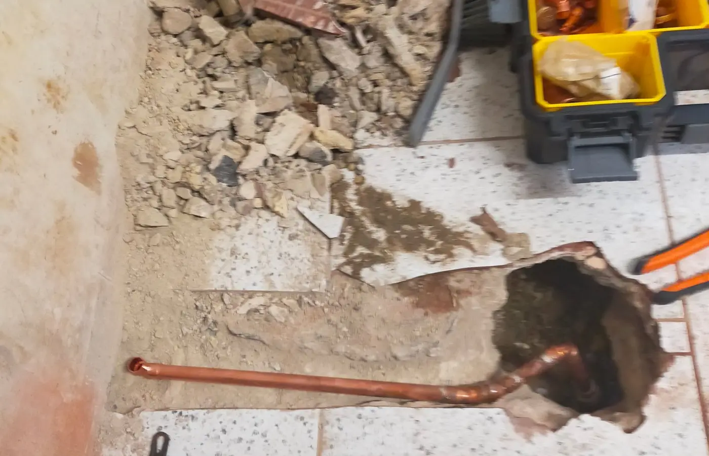Copper supply pipe laid into the floor for a fridge freezer water feed